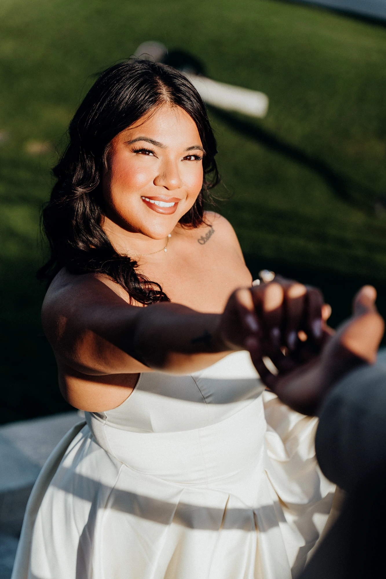 Radiant bride sharing a first-look moment outdoors